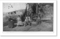 Mrs. Mearns seated with farm family, incl. dog, in front of farm buildings, Vintage Poster