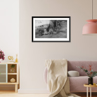 Mrs. Mearns seated with farm family, incl. dog, in front of farm buildings, Vintage Poster