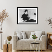 Eleanor Roosevelt, half length, facing right, standing before microphone, Antique Poster