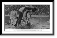 Historic Framed Print, Jesse Owens breaking the record in running broadjump. Berlin Olympics, 1936,  17-7/8" x 21-7/8"