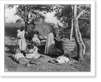 African-American woman doing laundry with a scrub board and tub, African-American girl stirring pot with 3 other children on the ground watching, and a woman in the background spreading laundry T
