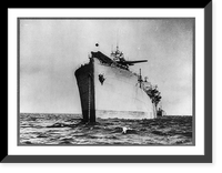 A Royal Air Force Hurricane fighter plane on the catapult of the S.S. EMPIRE TIDE, where it is ready to take off and intercept enemy bombers from attacking the convoy - 1942 Classic Wall Art Pri
