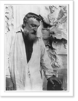 Auguste Rodin, 1840-1917, three quarters length portrait, face looking down, facing right, hand on sculpture. Taken in Meudon, France, about 1906, Vintage Wall Art