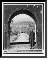 Historic Framed Print, [Kai-Shek Chaing, 1886- , full, standing, in portal, wearing robe, facing front.],  17-7/8" x 21-7/8"