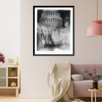 View of the U.S. Capitol during the fire which destroyed the studio of Artist Chas. Moberly & considerably damaged the House Document Room - fire engines with ladders going up the side of the Capit