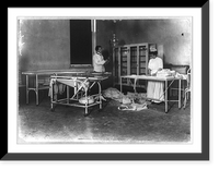 Historic Framed Print, [A man and a woman working in an operating room],  17-7/8" x 21-7/8"