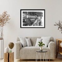 Historic Framed Print, Spinner in Vivian Cotton Mills, Cherryville, N.C. Been at it 2 years. Where will her good looks be in ten years?. Location: Cherryville, North Carolina.,  17-7/8" x 21-7/8"