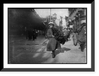 Historic Framed Print, Young girl carrying bundle of coats home to be finished. Near Astor Place, N.Y. Location: New York, New York (State),  17-7/8" x 21-7/8"