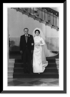 President Lyndon B. Johnson escorting Miss Lynda Bird Johnson, who is wearing wedding gown; standing on steps in White House, Historic Print