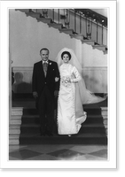 President Lyndon B. Johnson escorting Miss Lynda Bird Johnson, who is wearing wedding gown; standing on steps in White House, Historic Print