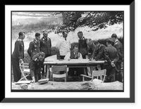 Hermann G&ouml;ring seated at outdoor table surrounded by standing Luftwaffe officers, Wildpark, Vintage Poster