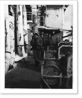 Coast Guardsmen running to their battle stations on the U.S. cutter SPENCER in the North Atlantic, after an enemy submarine had been contacted, Vintage Poster