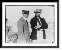Jack Dempsey at his training camp, June 1921: standing on beach with man; wearing visored cap, Antique Print
