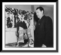 Jack Dempsey, 1895- , posed with Civil Defense poster A Strong America" showing Jesse Owens on starting blocks", Vintage Poster