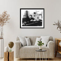 Historic Framed Print, [Isaac Stern, 1920- , head-and-shoulders portrait, seated at piano, facing left],  17-7/8" x 21-7/8"