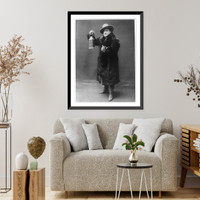 Enrico Caruso, 1873-1921, full-length portrait, standing, facing left, wearing fur coat and holding lantern, Vintage Poster