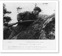 Soviet guerrilla activity in Russia, WWII: Scout with rifle watching enemy, Historic Reproduction