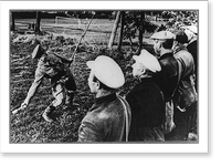 Soviet guerrilla activity in Russia, WWII: Russian soldier demonstrating to guerrillas correct method of handling hand grenade, Vintage Poster