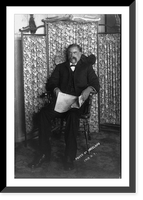 David E. George, full-length portrait, seated, facing left, holding newspaper Classic, Vintage Poster