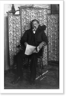 David E. George, full-length portrait, seated, facing left, holding newspaper Classic, Vintage Poster