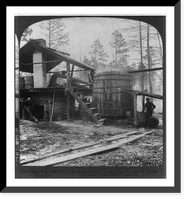 Historic Framed Print, Distilling turpentine from the crude resin in the pine forests of North Carolina,  17-7/8" x 21-7/8"