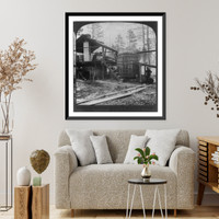 Historic Framed Print, Distilling turpentine from the crude resin in the pine forests of North Carolina,  17-7/8" x 21-7/8"