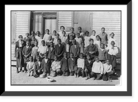 Historic Framed Print, [Group portrait of African American students and one adult, possibly teacher, standing outside a school house],  17-7/8" x 21-7/8"