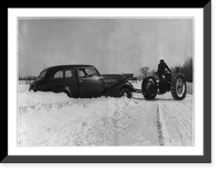 Warren Butters, farmer of Exeter, Maine, gets a lift out of a snow bank from the tractor Classic, Historic Print