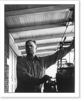 John Daniel Rust, 1892-1954, half-length portrait, standing, facing left; operating mahcine. Inventor of the cotton picker, Antique Poster