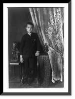 Historic Framed Print, [African American boy, full-length portrait, standing, facing front with left hand resting on table],  17-7/8" x 21-7/8"
