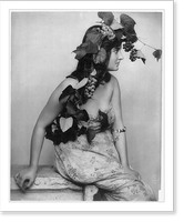 Young woman posed, seated, three-quarters length, facing right; with grapes, vines and leaves draped over head, Vintage Wall Art