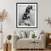 Young woman posed, seated, three-quarters length, facing right; with grapes, vines and leaves draped over head, Vintage Wall Art