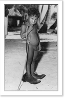Natives of Bikini Island before atomic bomb test: naked boy wearing very large shoes, Historic Print