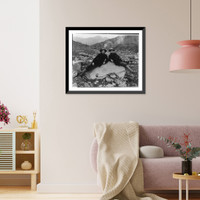 Two men recining on a large nugget of pure native copper in the bed of Nugget Creek, Valdez vicinity, Alaska Classic, Historic Reproduction
