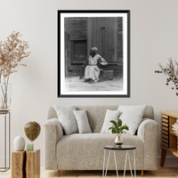 African American woman seated on step in front of building and holding basket, New Orleans, La, Vintage Wall Art