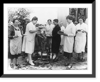 Group of farm women holding plates of cake and ice cream and spooning homemade ice cream out of freezers, Vintage Poster