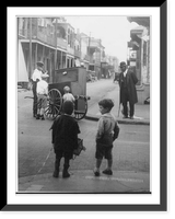 New Orleans, La.: Street scene showing 4 children and an African American man watching another African American man with a hurdy-gurdy(?) Classic, Vintage Wall Art