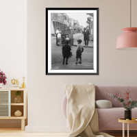 New Orleans, La.: Street scene showing 4 children and an African American man watching another African American man with a hurdy-gurdy(?) Classic, Vintage Wall Art