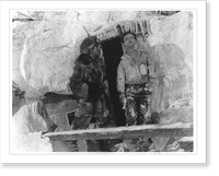 Houdini in front of doorway of cabin, covered with ice and snow, with man in fur parka, Historic Print