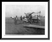 Houdini with group of men assembling small airplane, Vintage Print