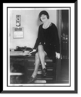 Historic Framed Print, [Beatrice Houdini, full-length portrait, facing front, seated on desk],  17-7/8" x 21-7/8"