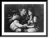Movie still of William S. Hart in: Desert Man(?) - seated with arms around woman and child, Historic Print