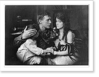 Movie still of William S. Hart in: Desert Man(?) - seated with arms around woman and child, Historic Print