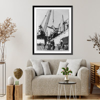 New York Port of Embarkation during World War II: Loading a P-47 is a ticklish job- loading an airplane on a ship Classic, Historic Print
