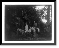 Panama during time of Panama Canal construction: 2 men on horseback by wall overgrown with vines, Antique Poster