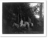 Panama during time of Panama Canal construction: 2 men on horseback by wall overgrown with vines, Antique Poster
