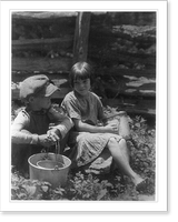 Historic Framed Print, [Boy and girl seated in a garden, holding buckets],  17-7/8" x 21-7/8"
