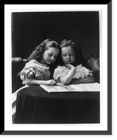 Historic Framed Print, [Two small girls reading at small round table],  17-7/8" x 21-7/8"