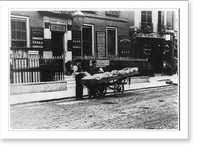 Historic Framed Print, [2 men by wagonload of china(?) in front of the London & Naval Hotel, London, 1884(?)],  17-7/8" x 21-7/8"