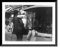 Historic Framed Print, [Chinese in Chinatown, San Francisco, on street: Man with long pigtail holding child],  17-7/8" x 21-7/8"